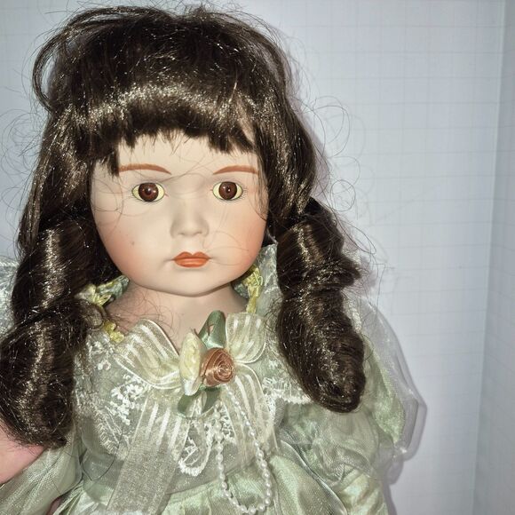 Heirloom Treasure Doll, Dark Long Curley Hair with Green Dress and Bow on Front - Picture 3 of 10